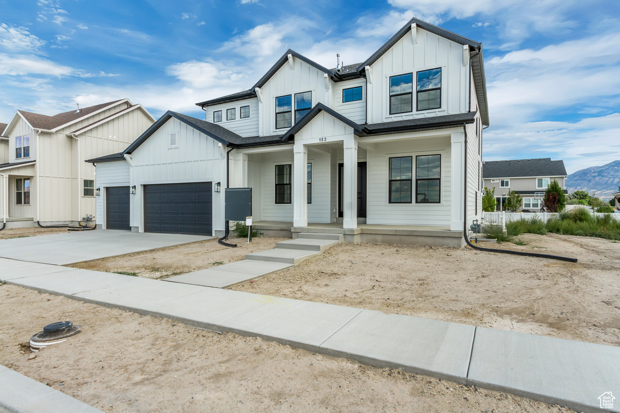 Modern farmhouse style home featuring a garage