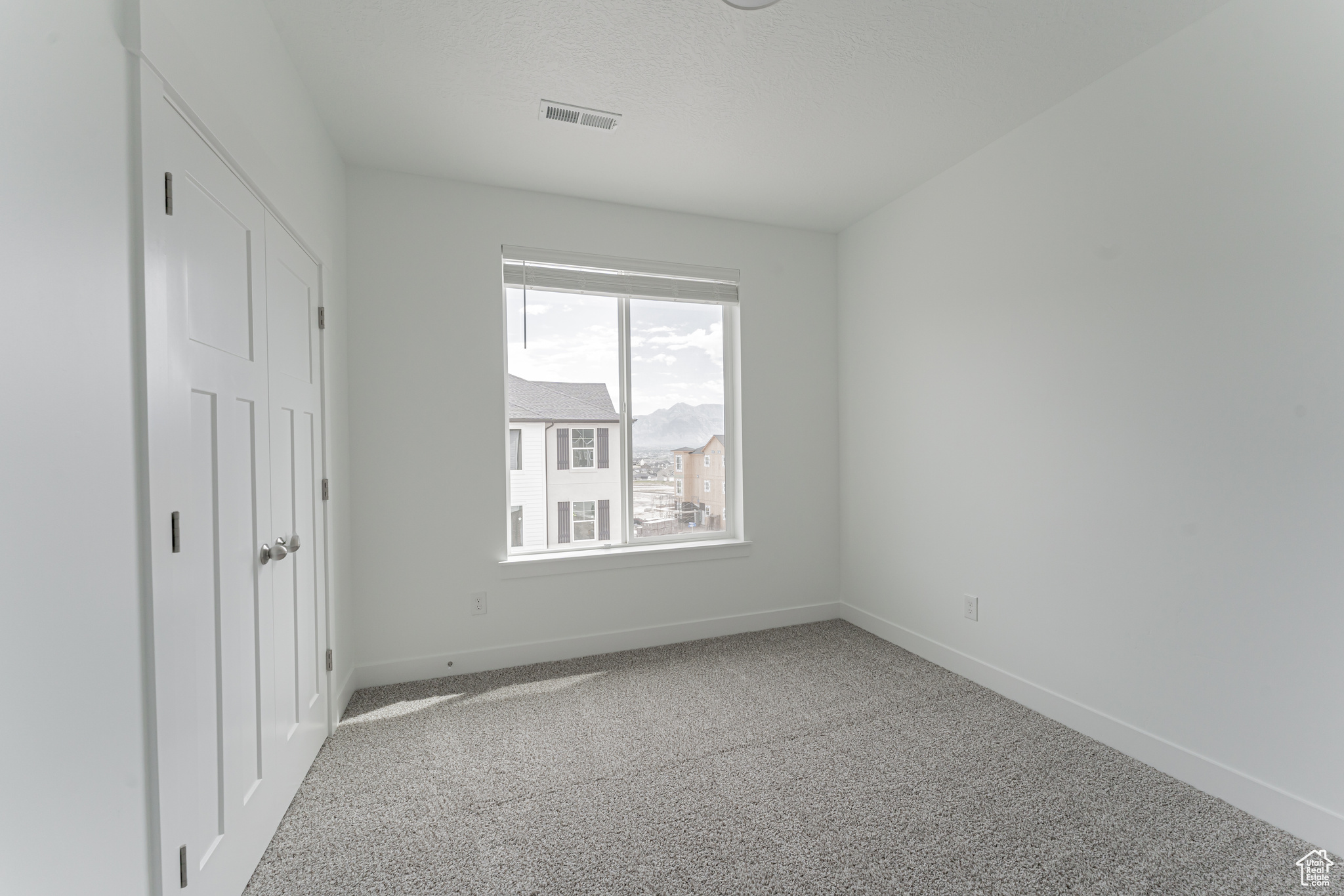 Unfurnished bedroom with carpet