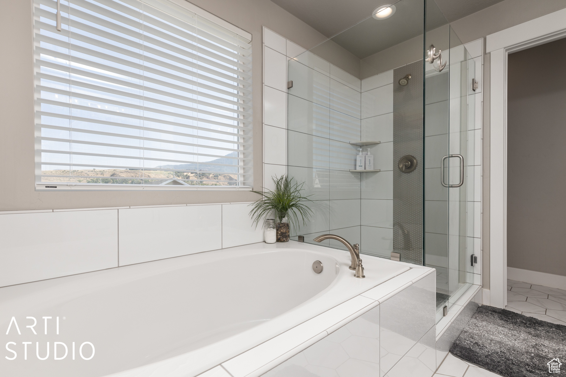 Primary bathroom with plus walk in shower and tile patterned flooring