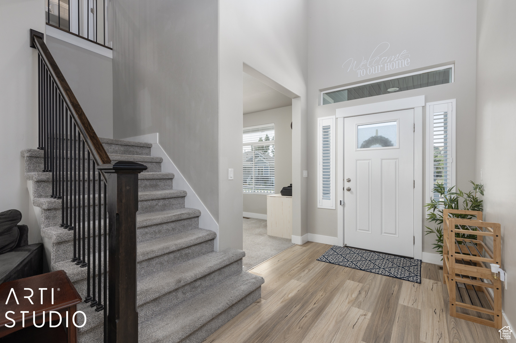 Foyer entrance with light hardwood / wood-style flooring