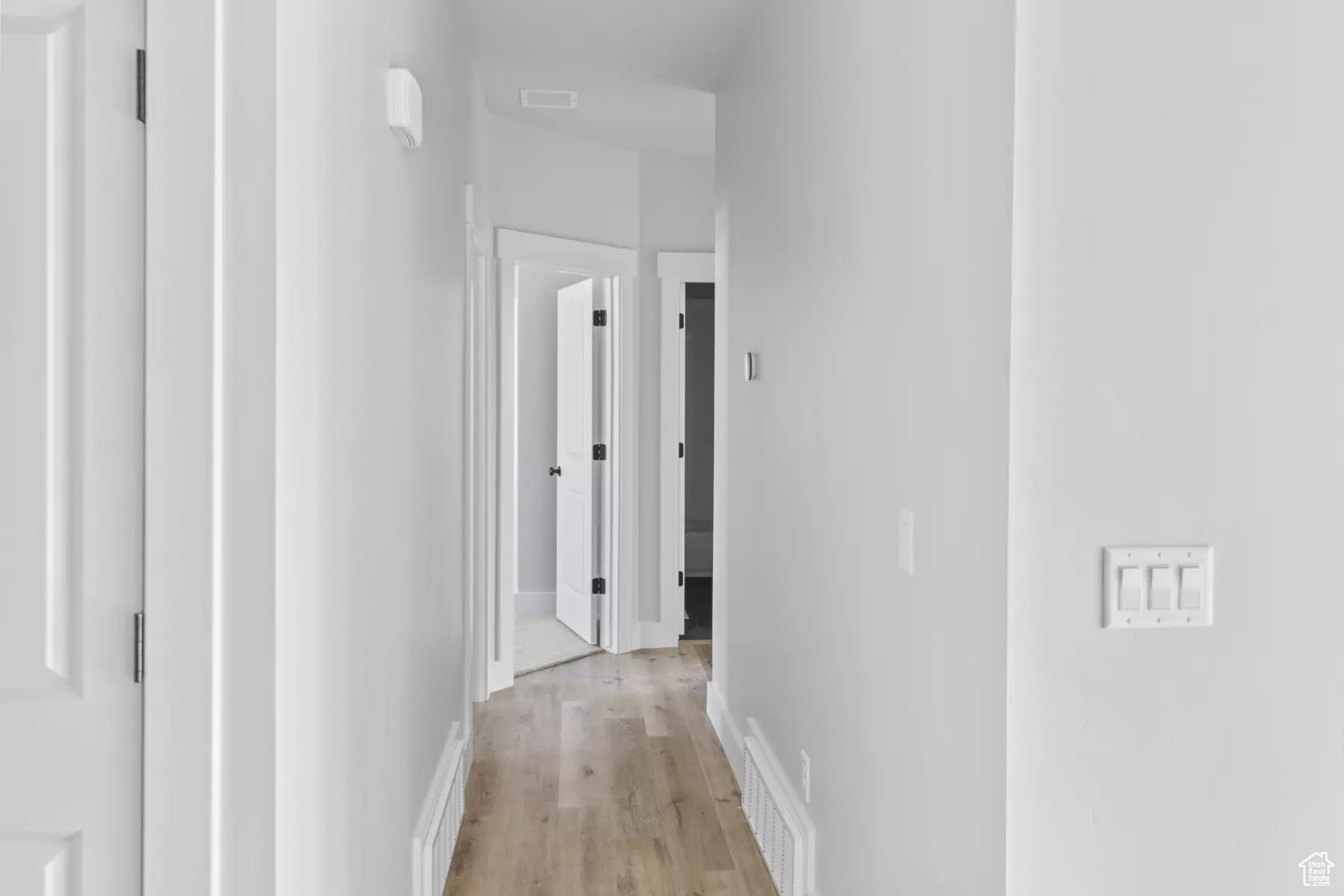 Hallway featuring light wood-type flooring