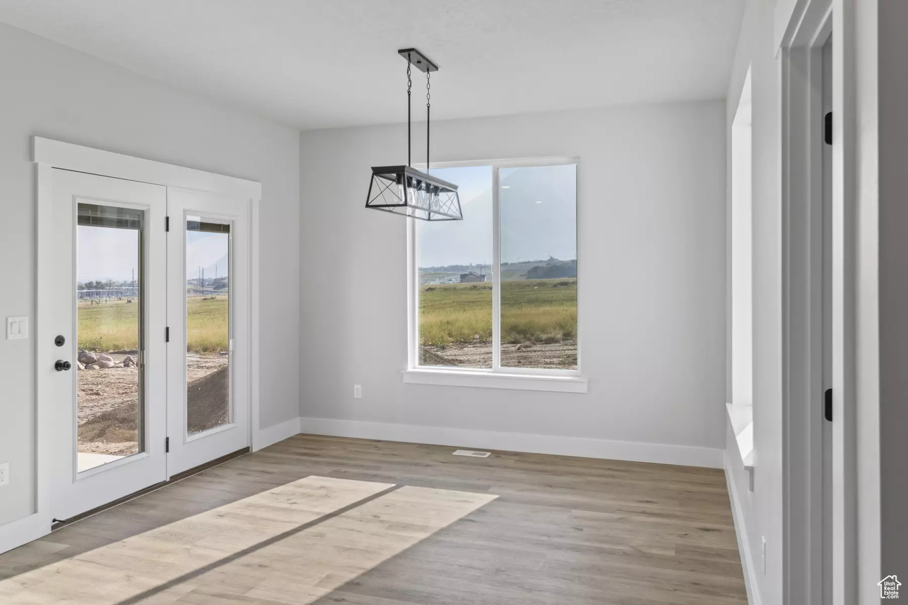 Unfurnished dining area with light hardwood / wood-style floors