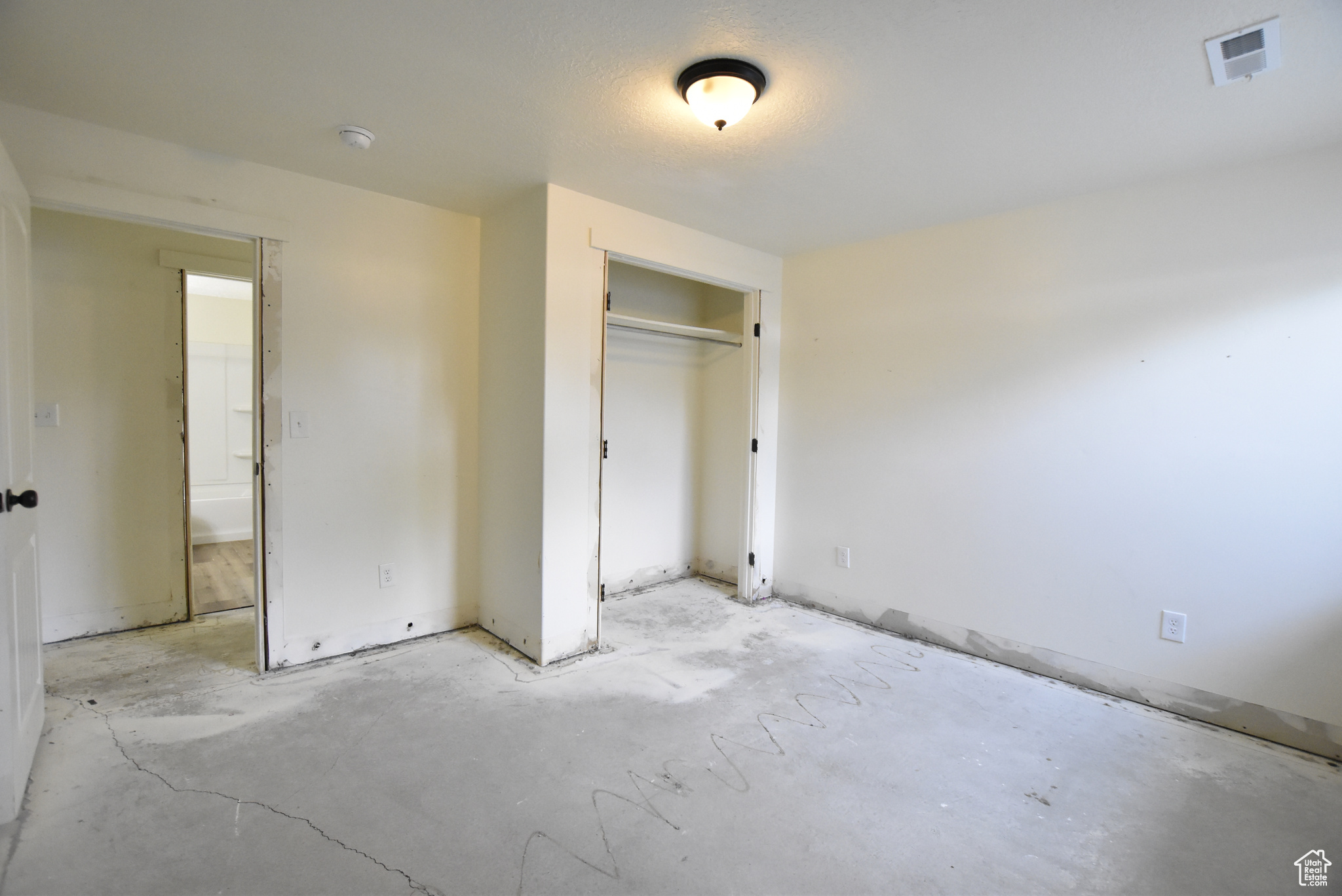 Unfurnished bedroom featuring a closet