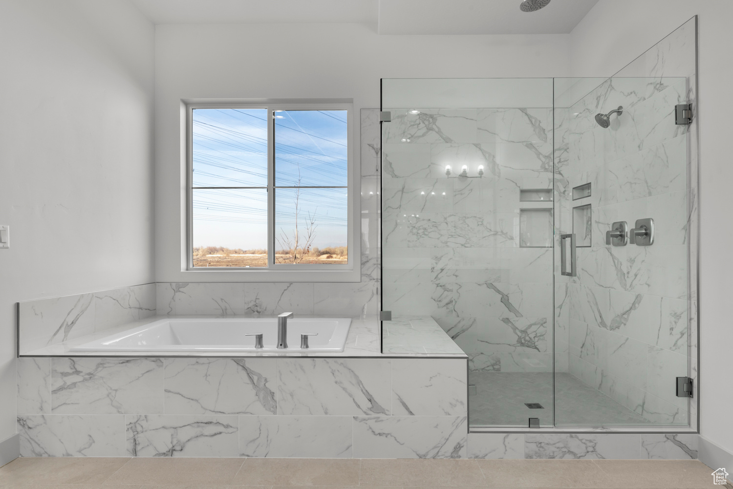 Bathroom featuring separate shower and tub