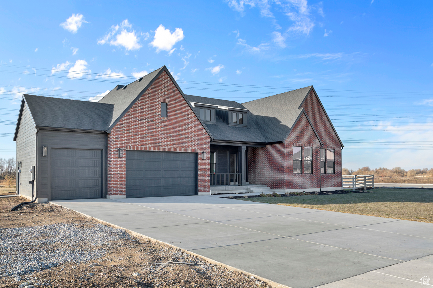 View of front of property featuring a garage