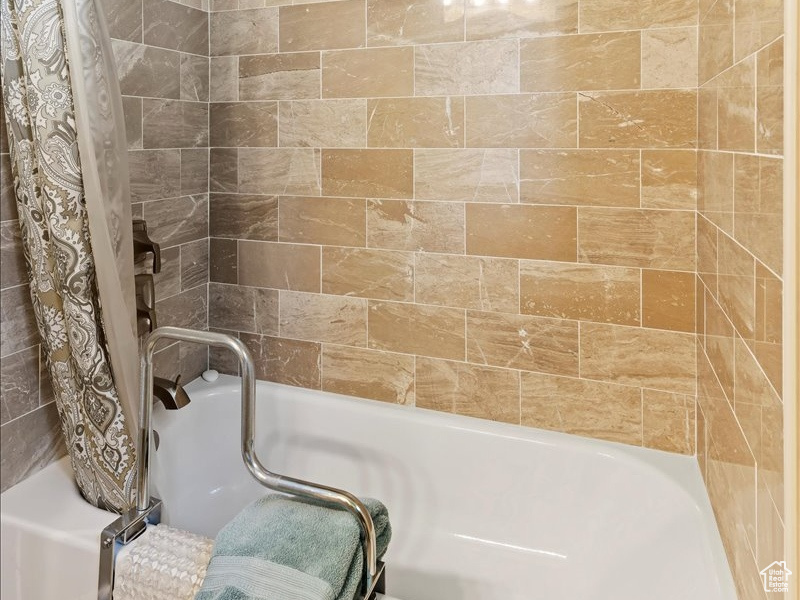 Bathroom featuring shower / tub combo