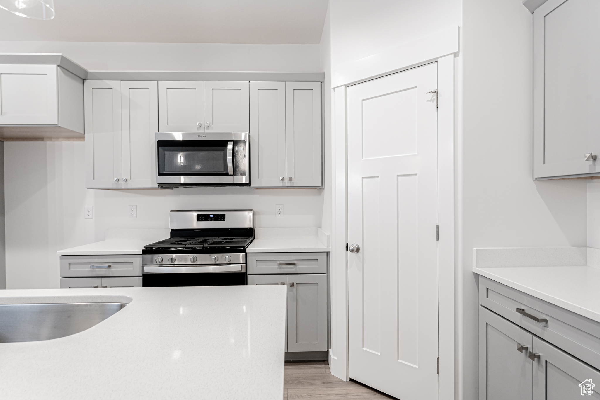 Kitchen featuring stainless steel appliances and light wood-type flooring