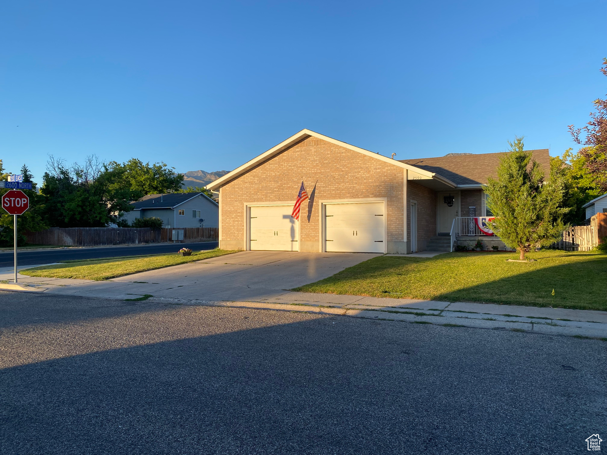 View of front of home featuring a garage and a front lawn