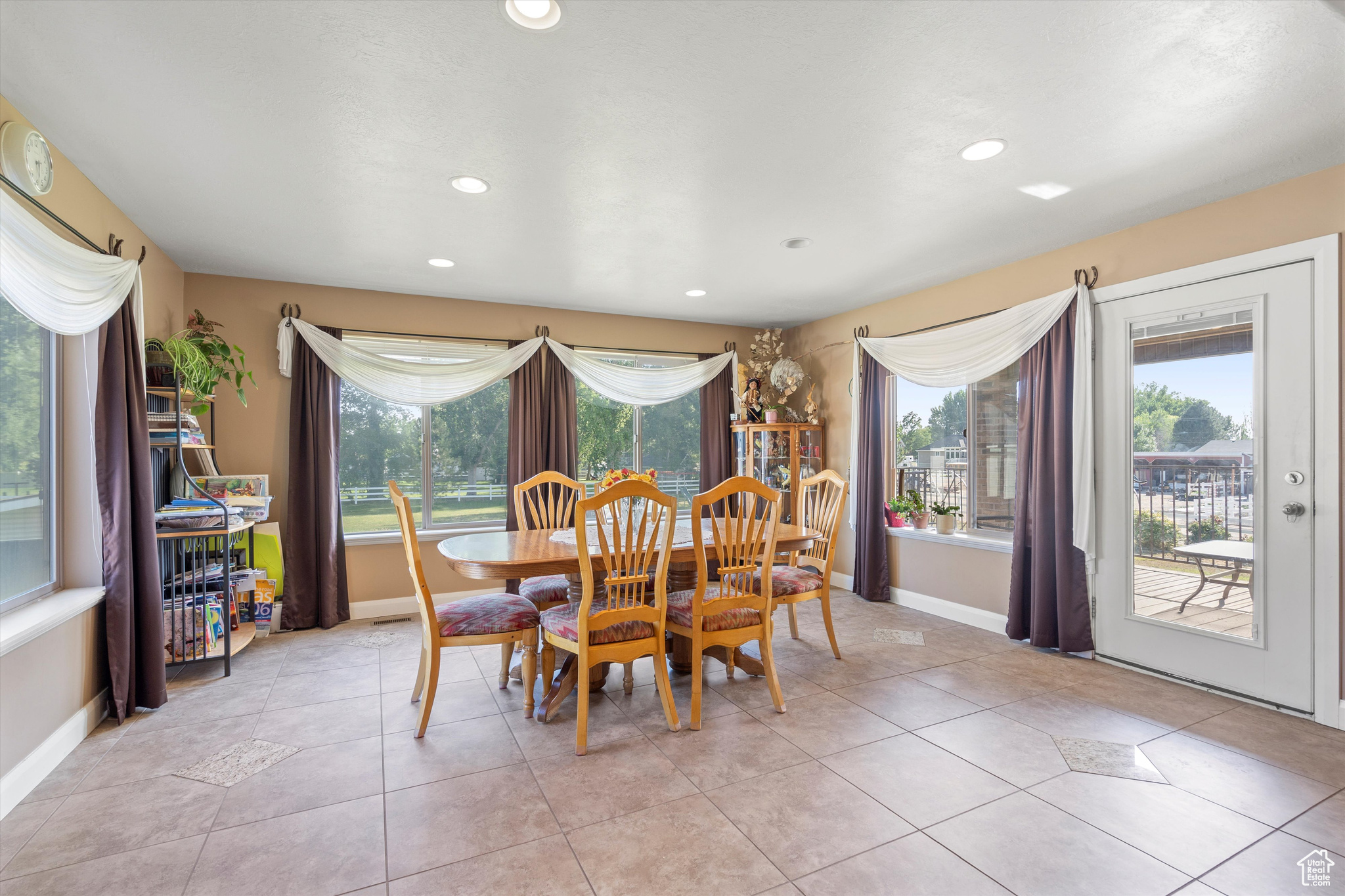 Tiled dining space with plenty of natural light