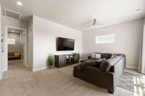 Living room with light carpet and ceiling fan