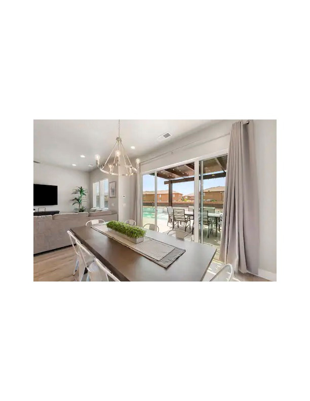 Unfurnished dining area featuring light hardwood / wood-style floors and a notable chandelier