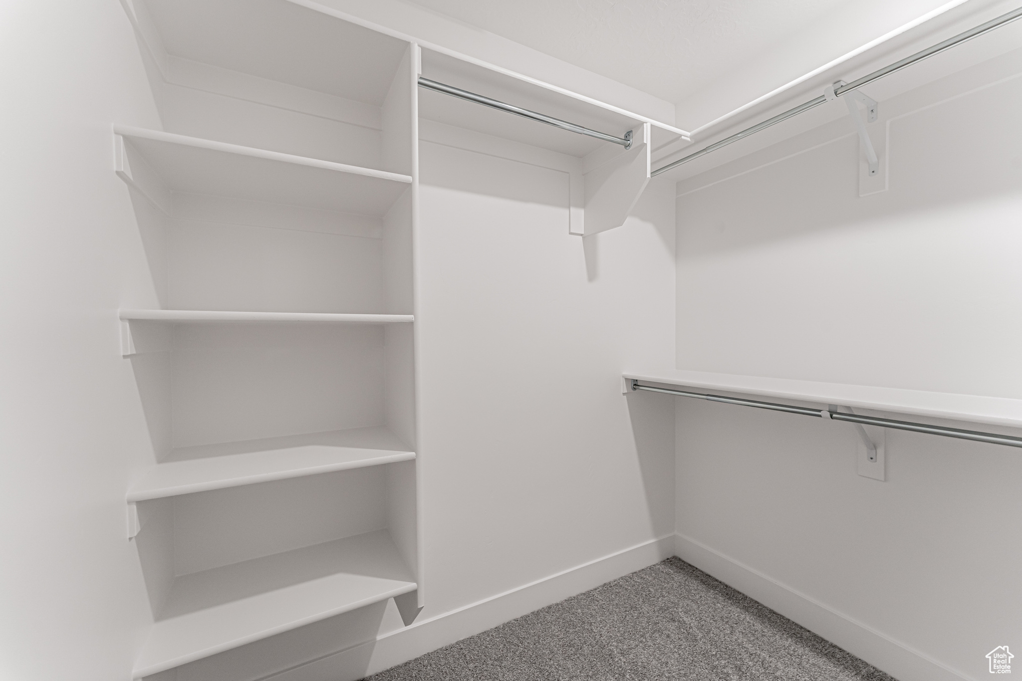 Spacious closet with carpet flooring