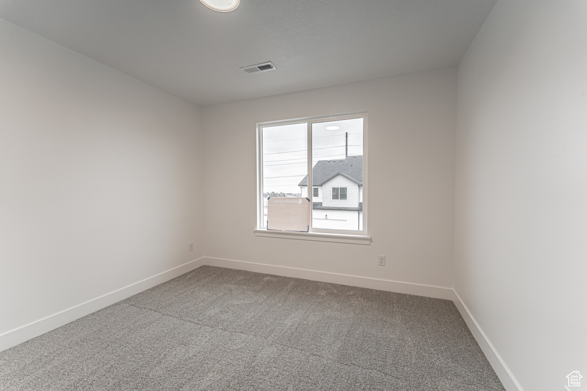 View of carpeted spare room