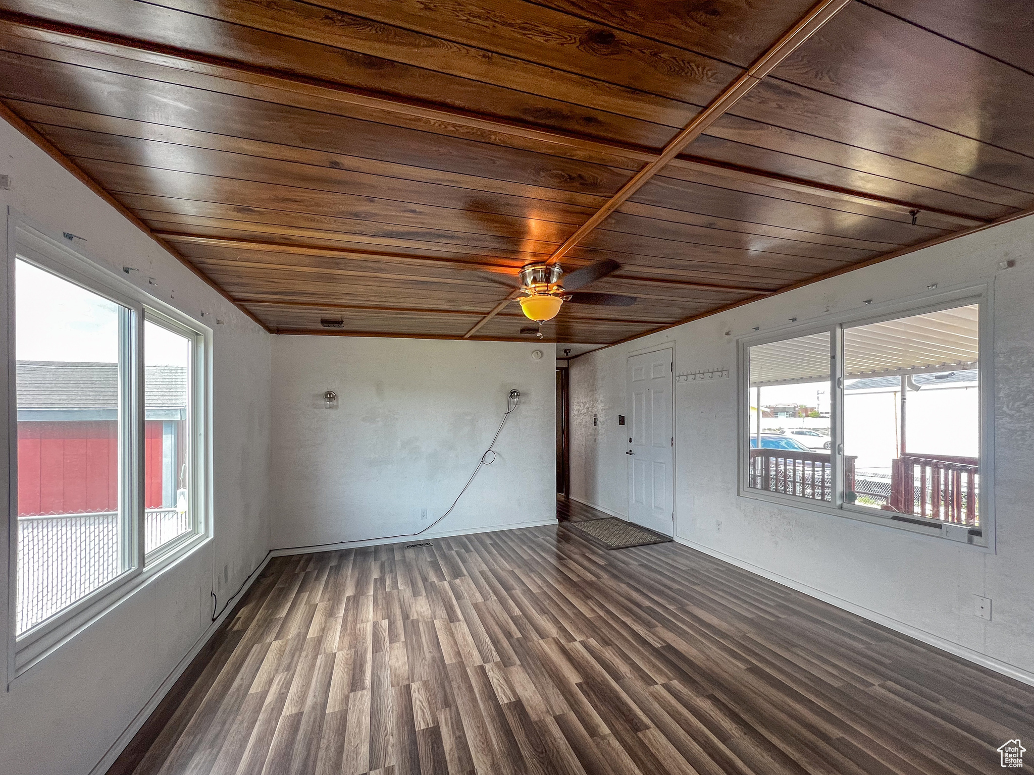 Interior space featuring wood-type flooring, ceiling fan, and wood ceiling