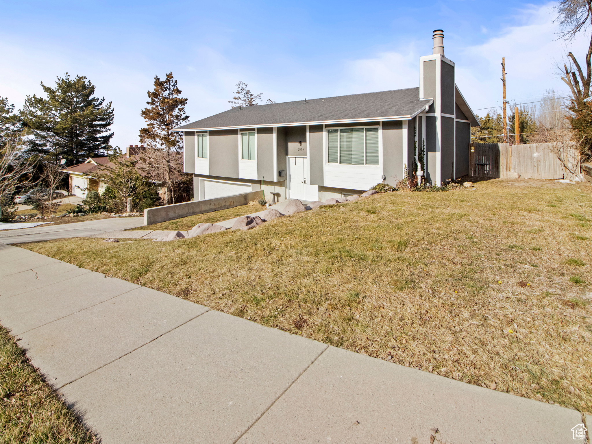 View of front of property with a front yard