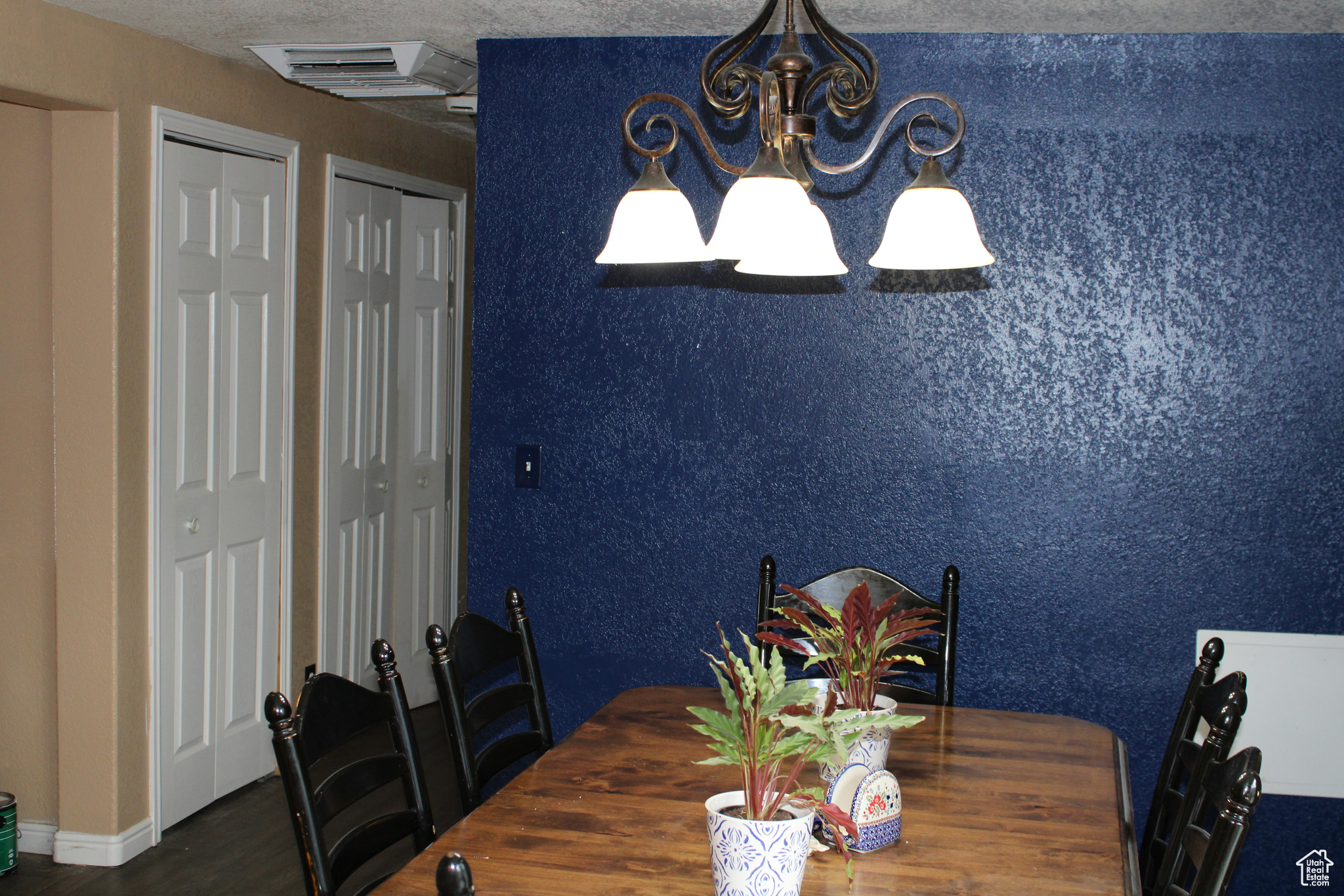 Dining space with a textured ceiling.