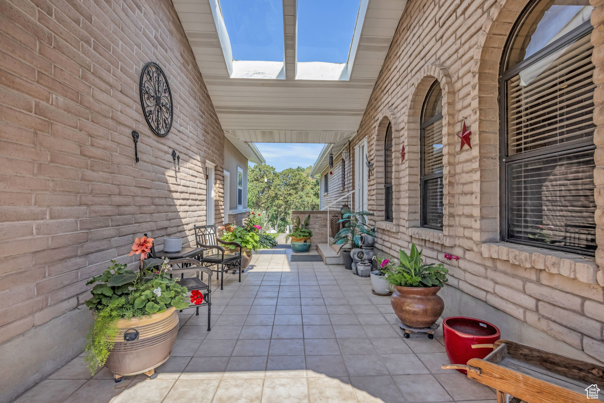 View of patio / walk way to house and garage, and bonus room