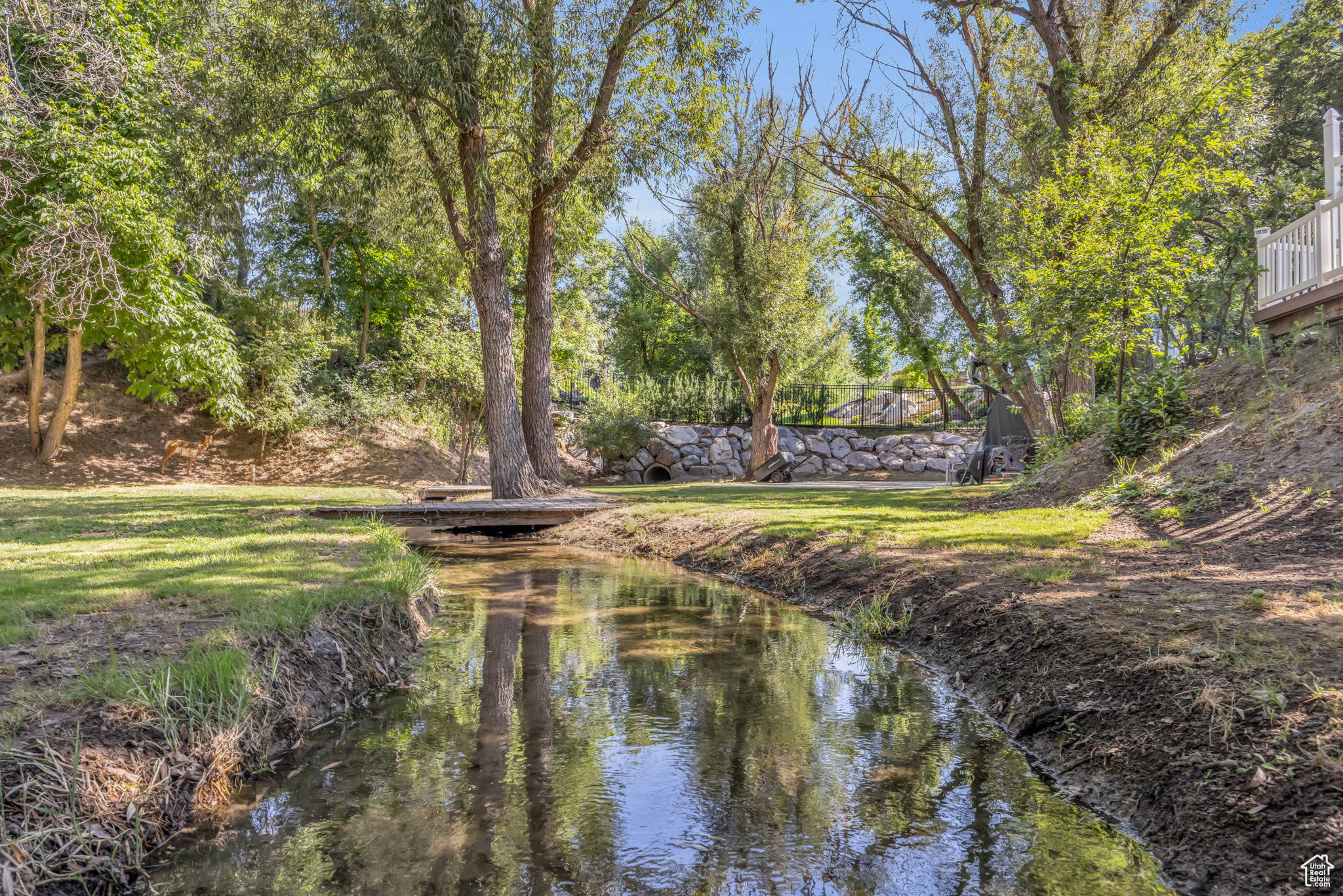 Creek/Gully, basketball court, archery range, on the lower level of the property below the pool area.