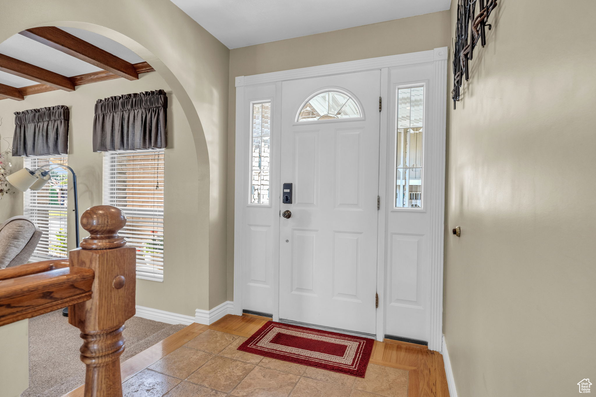 Foyer with beamed ceiling and a wealth of natural light