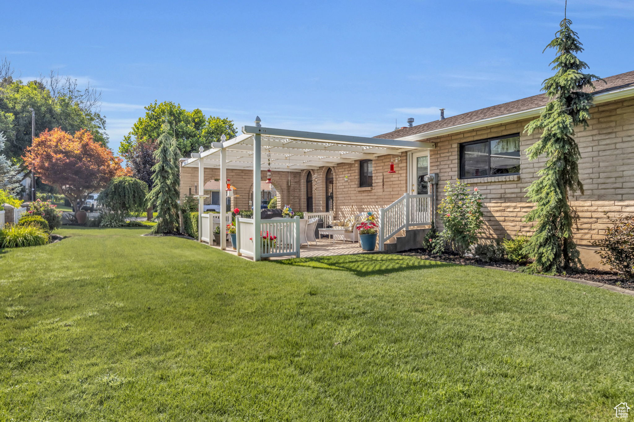 North Side of property with a yard and a patio