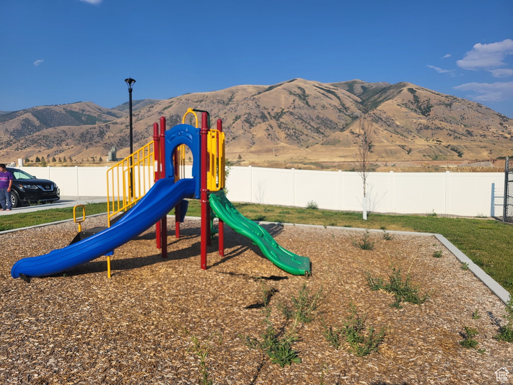 View of jungle gym featuring a mountain view