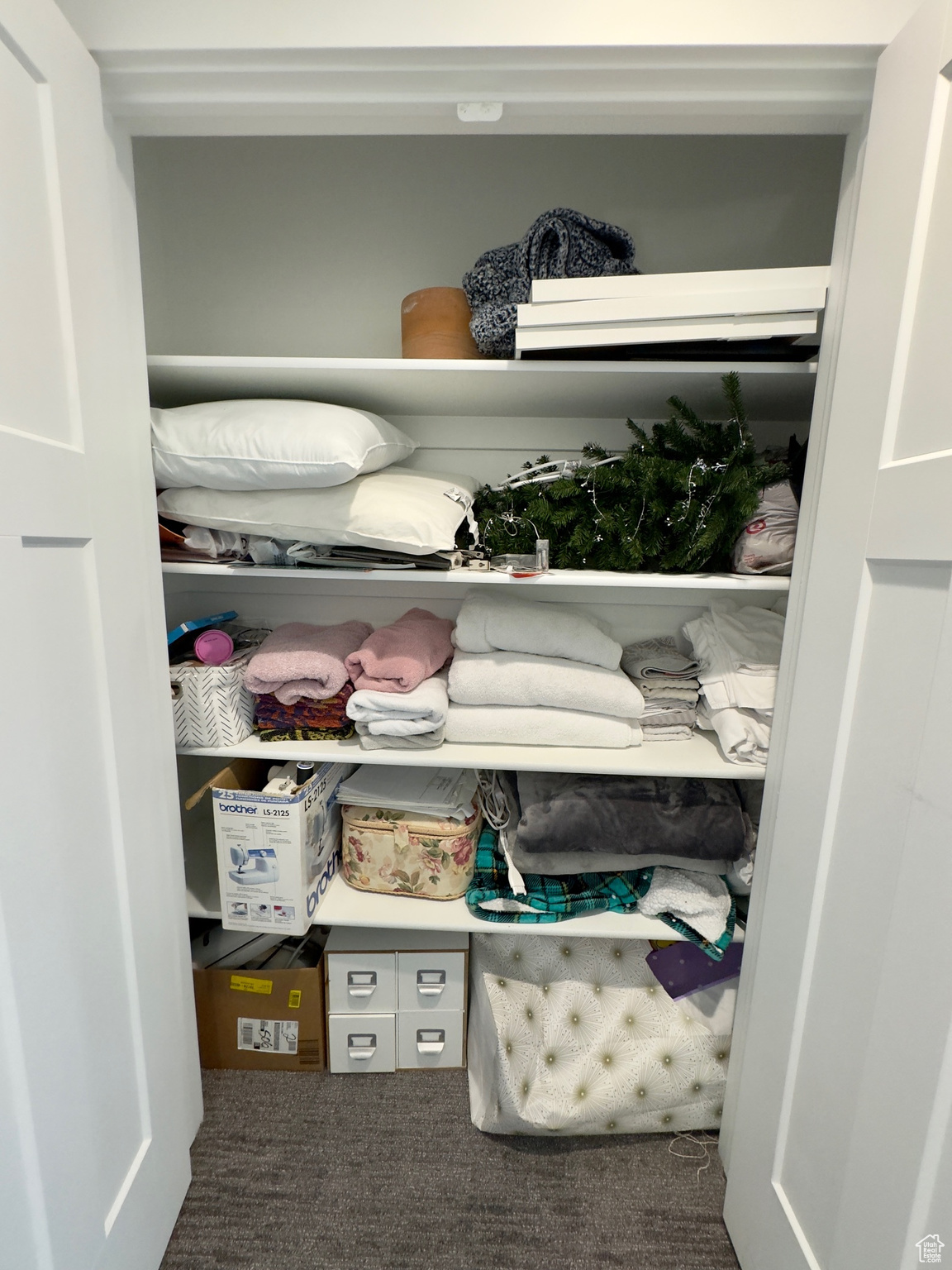 Hall closet on the top floor. There is storage galore!