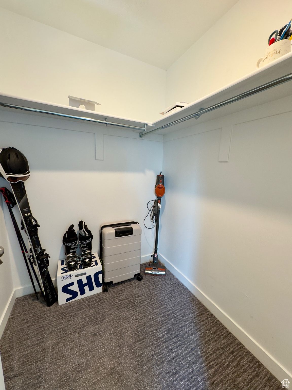 Walk in closet in master bedroom with window