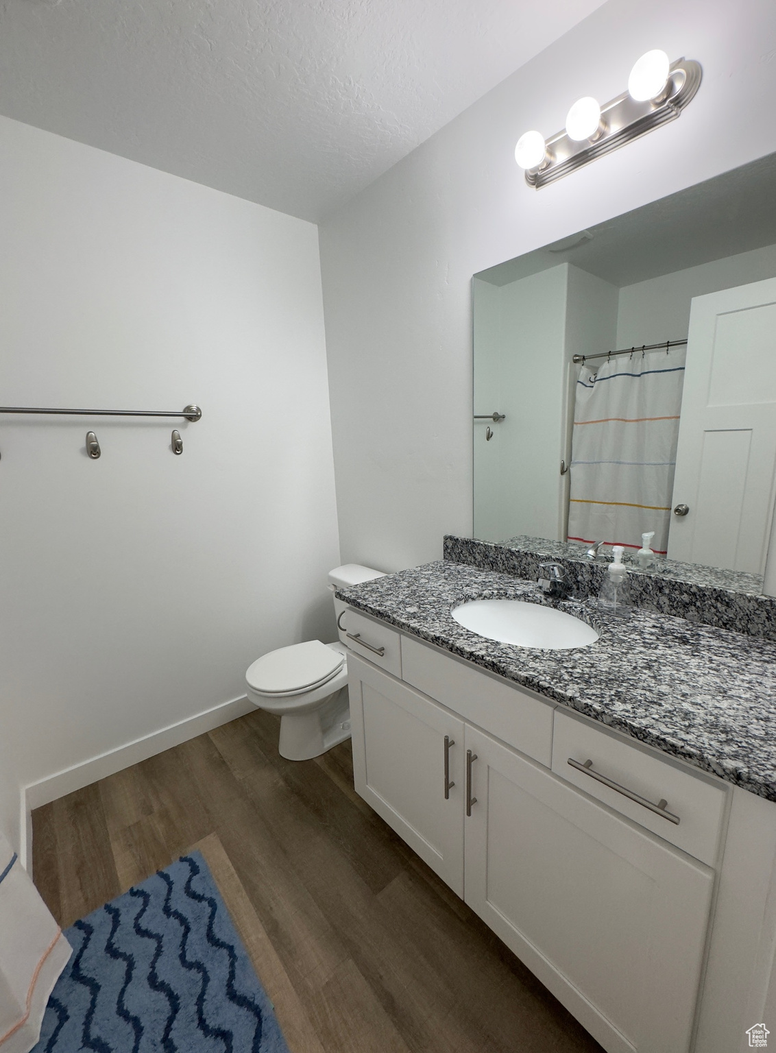 Hall bathroom on top floor with granite counters