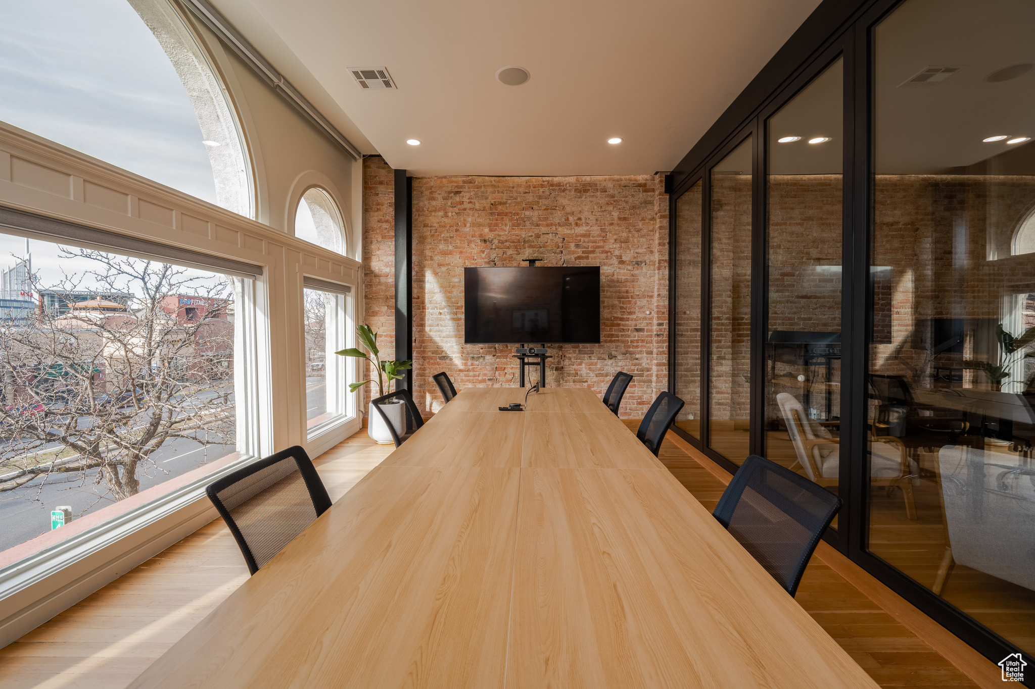 Conference Room with convertible glass wall and large windows overlooking downtown Ogden.