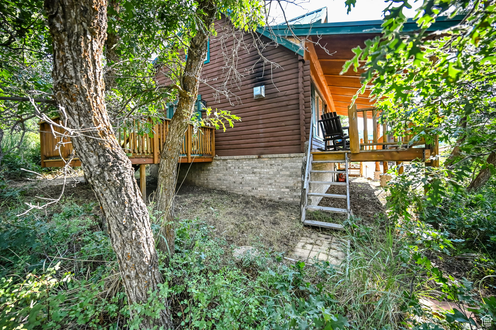 View of property exterior featuring a deck