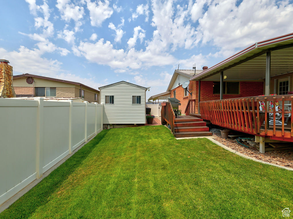 View of yard featuring a deck