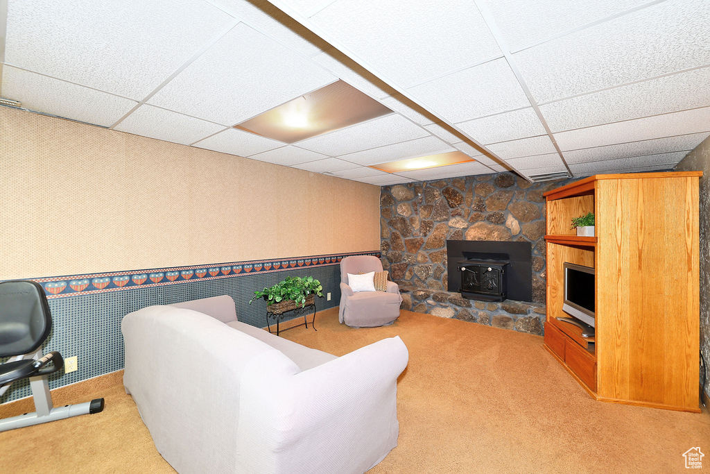 Carpeted living room featuring a fireplace