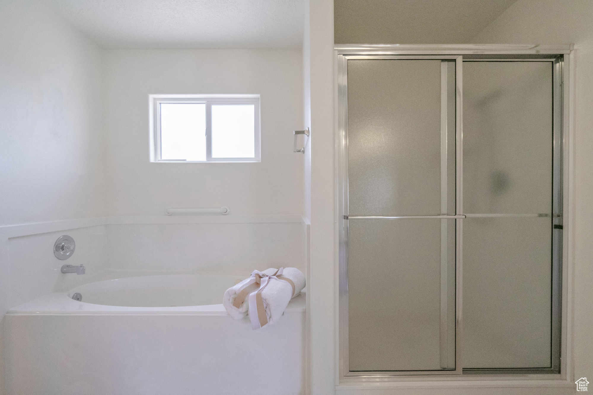 Primary Bathroom with walk in shower and jetted tub