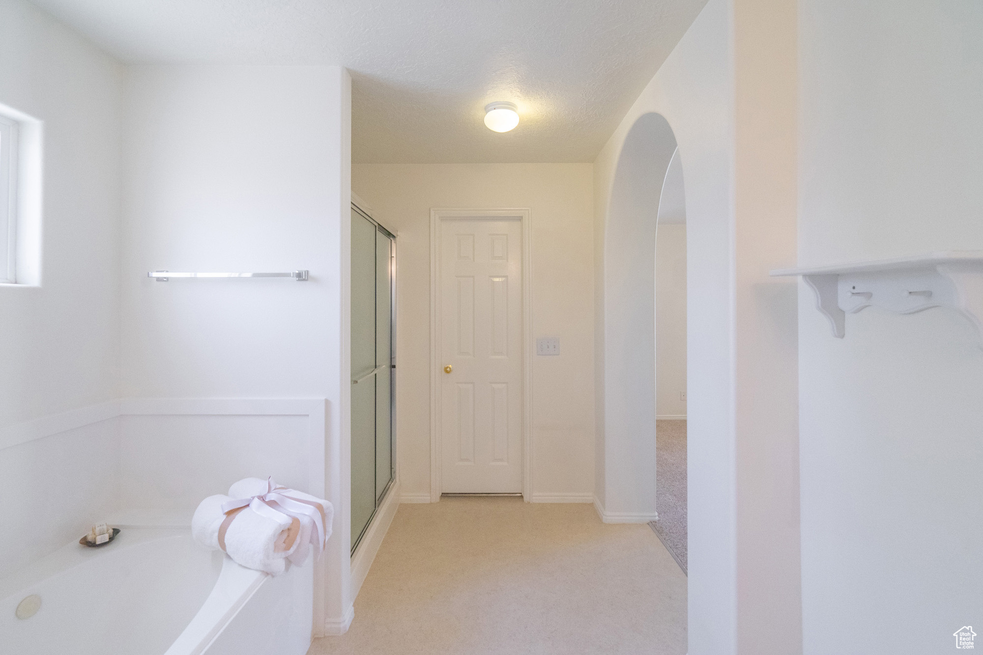 Primary Bathroom featuring separate shower and tub