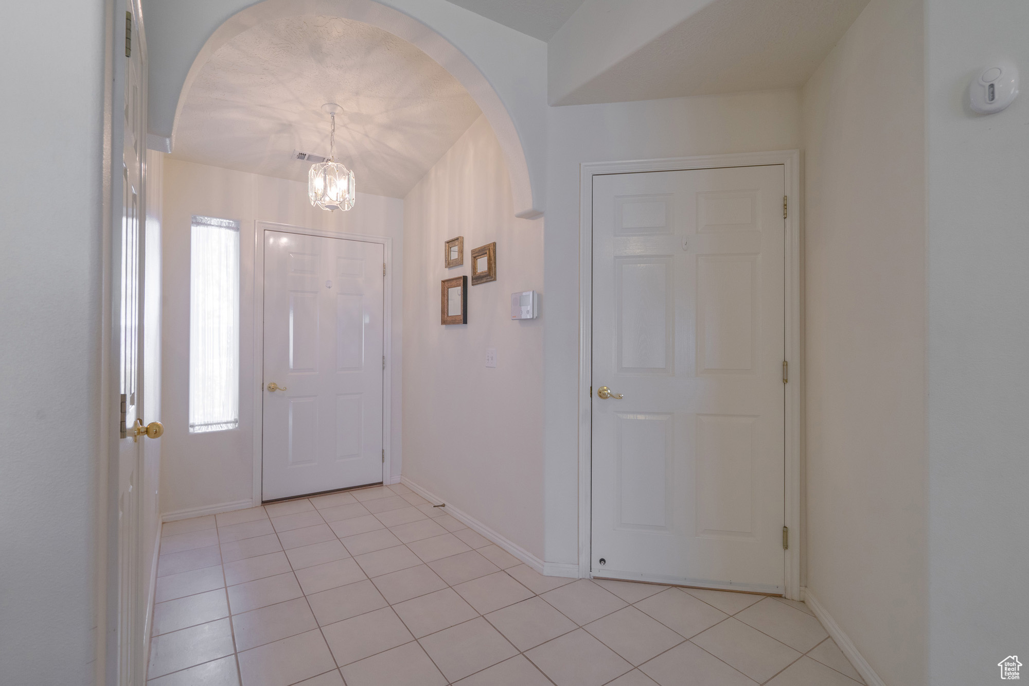 View of tiled foyer with access to garage