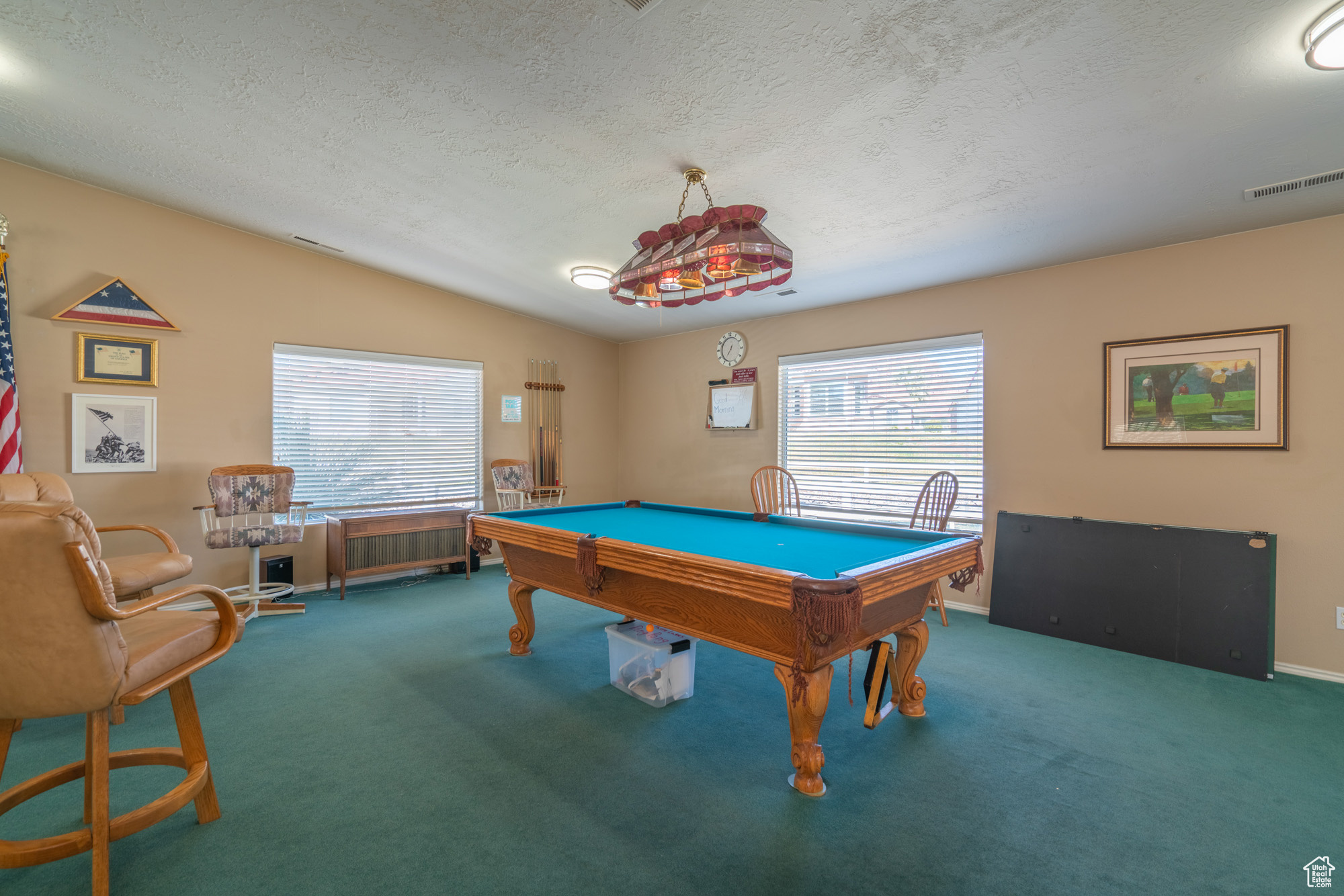 Rec room featuring carpet floors, a textured ceiling, lofted ceiling, and billiards