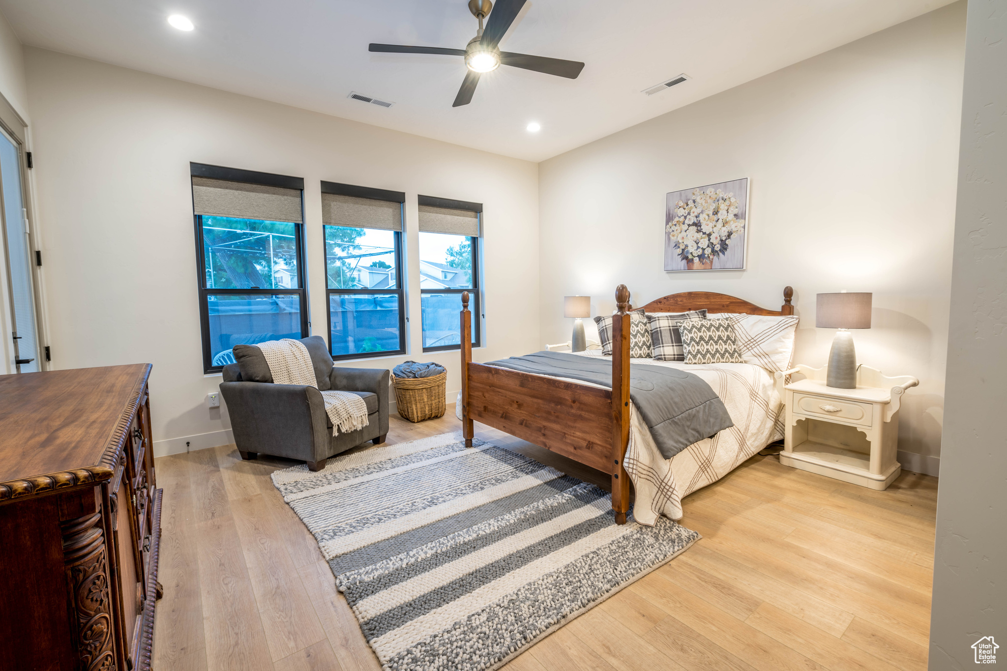 MasterBedroom with ceiling fan and light wood-type flooring