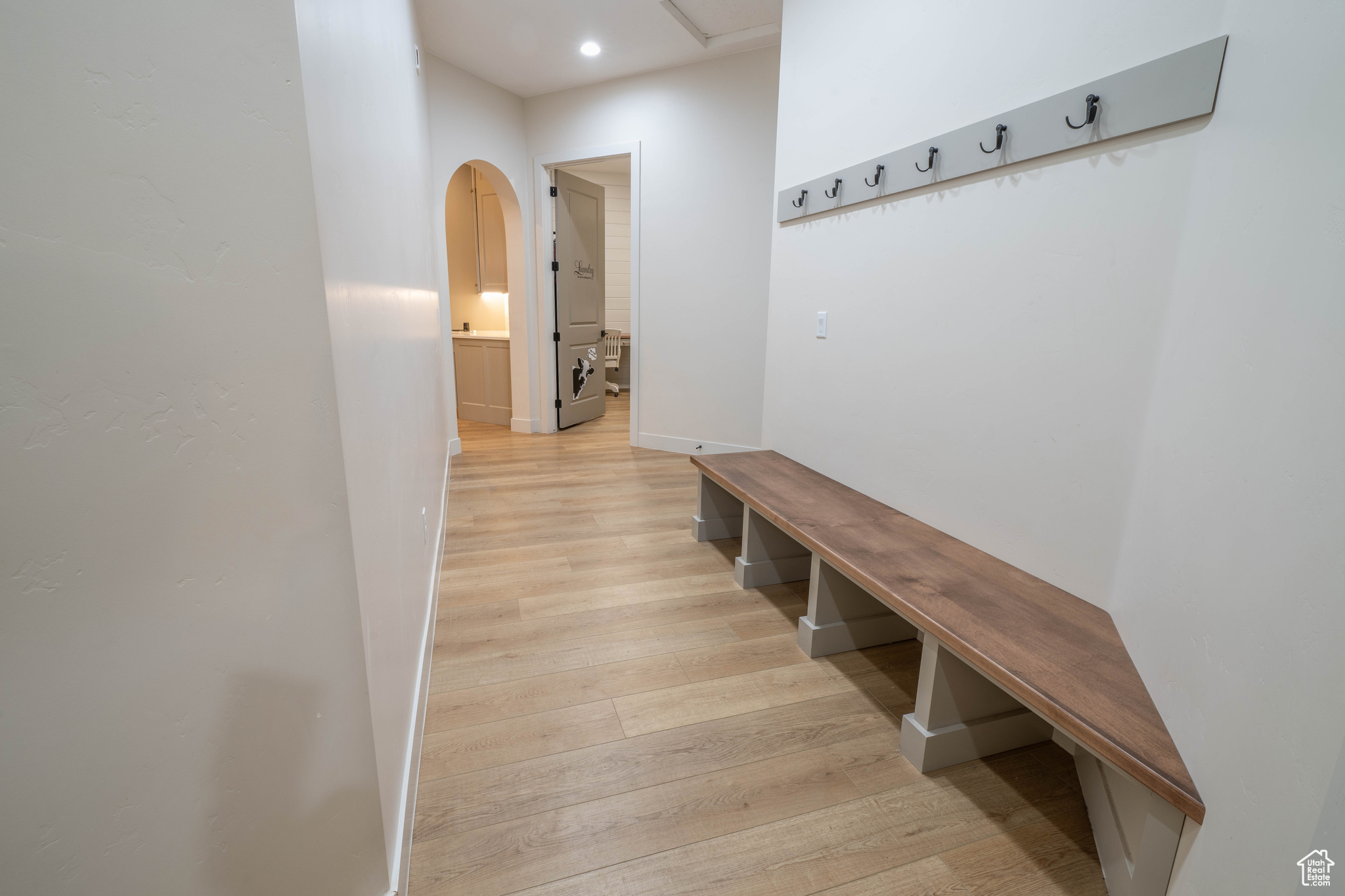 Mudroom featuring light wood-type flooring