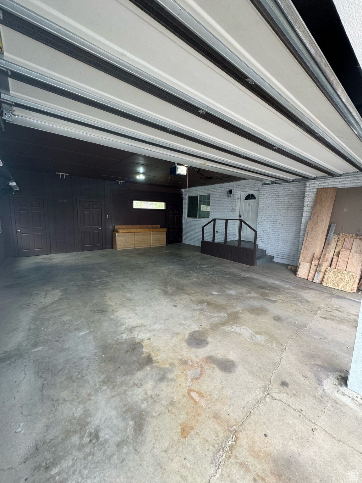 Garage featuring a garage door opener