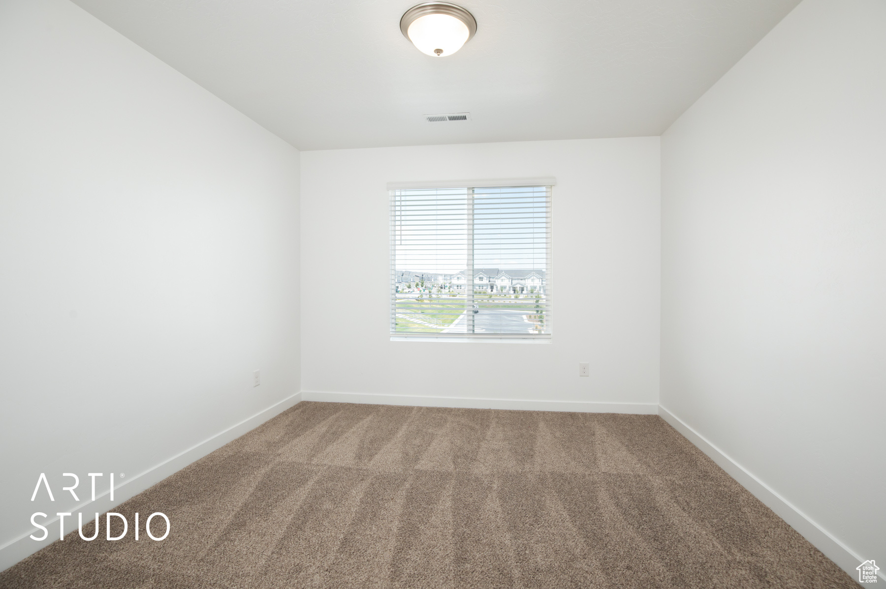 View of carpeted spare room