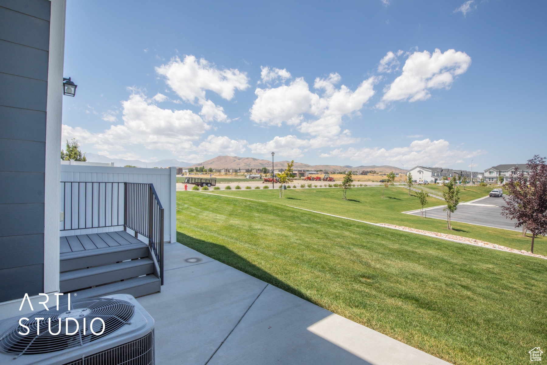 View of patio / terrace featuring central AC and a mountain view