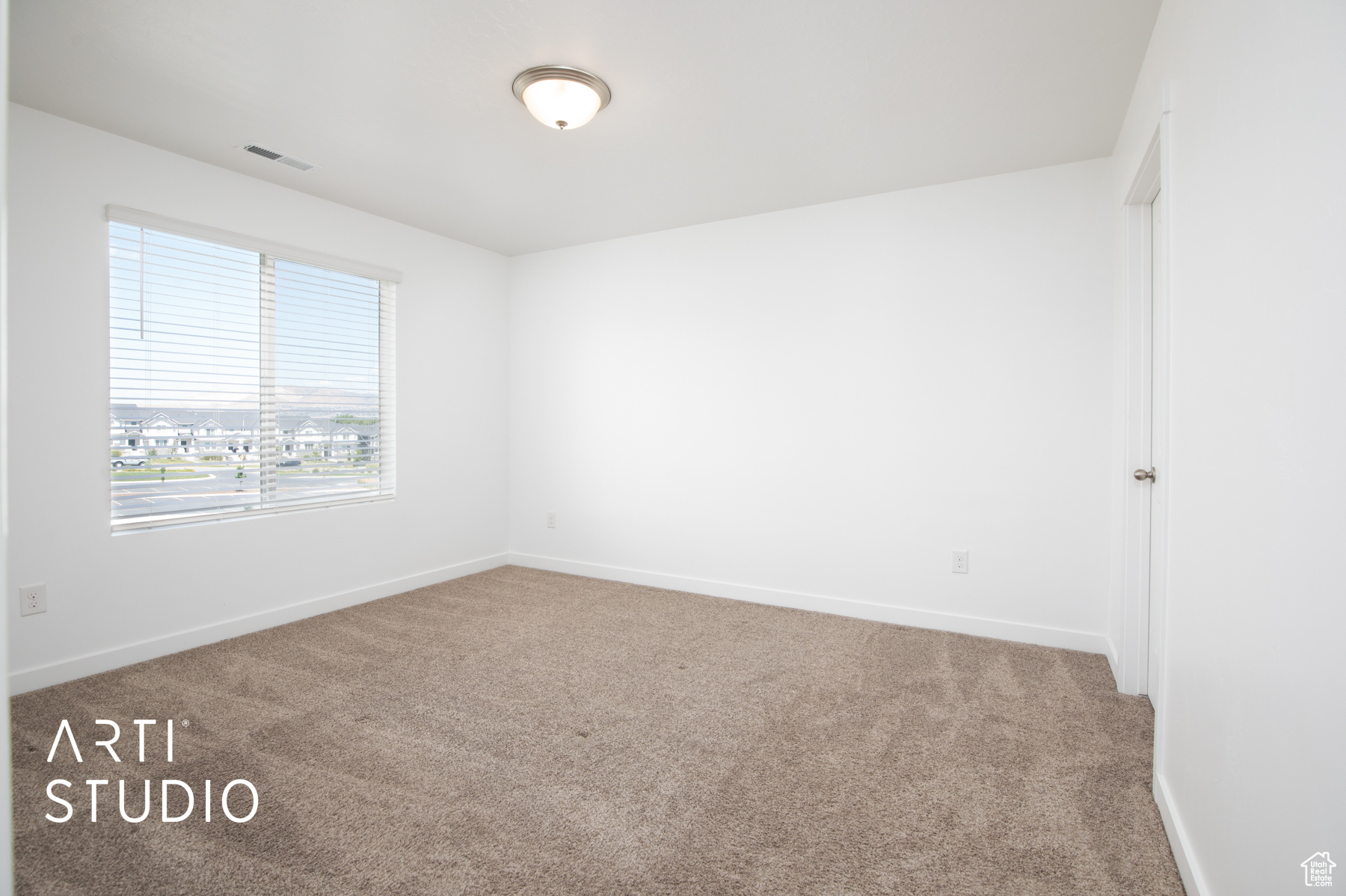 Empty room with carpet floors