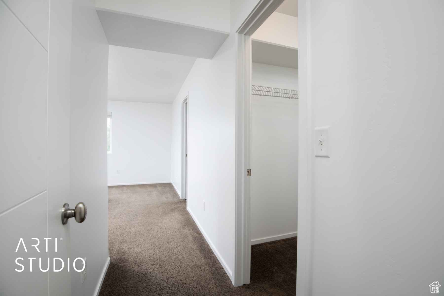 Hallway with carpet floors