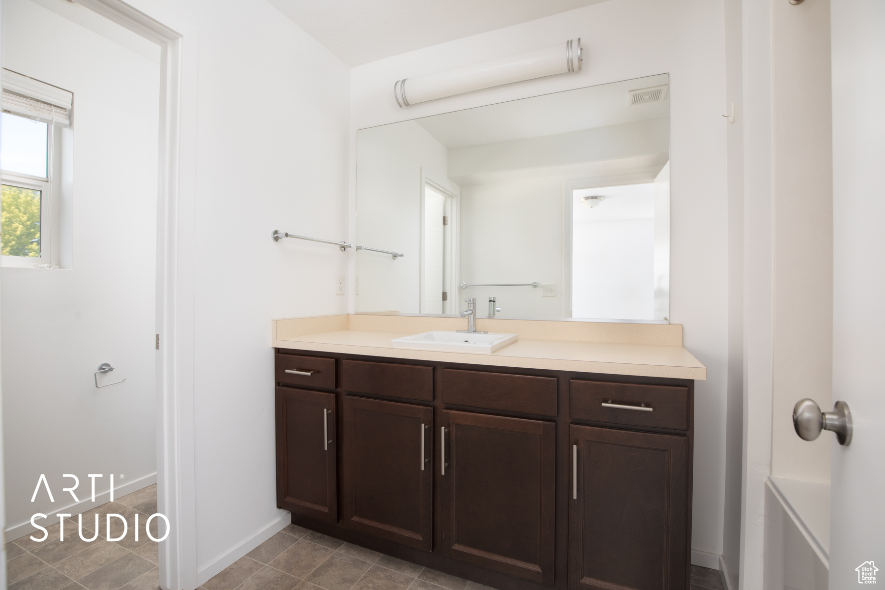 Bathroom featuring vanity and tile patterned flooring