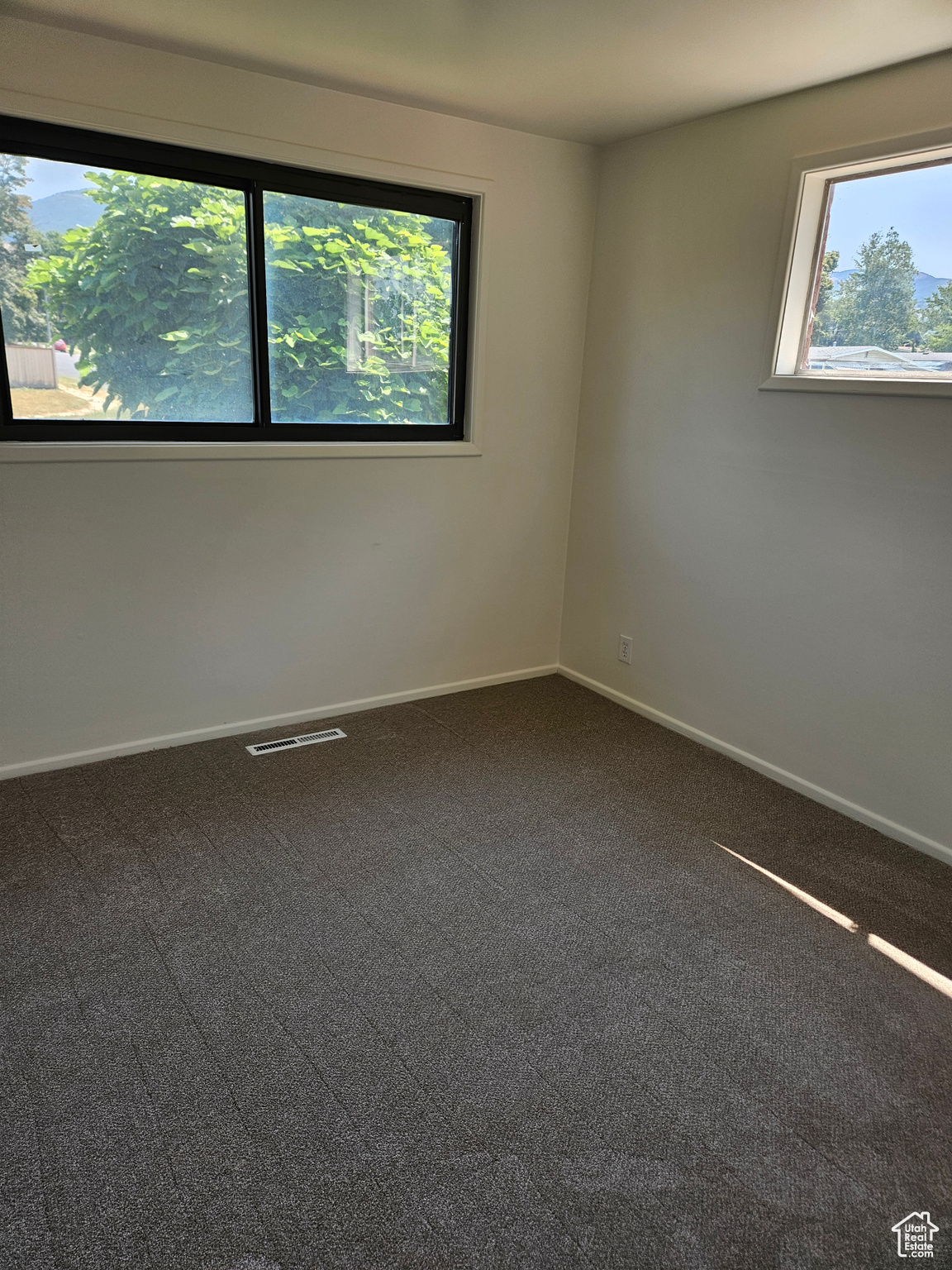 Empty room with carpet floors