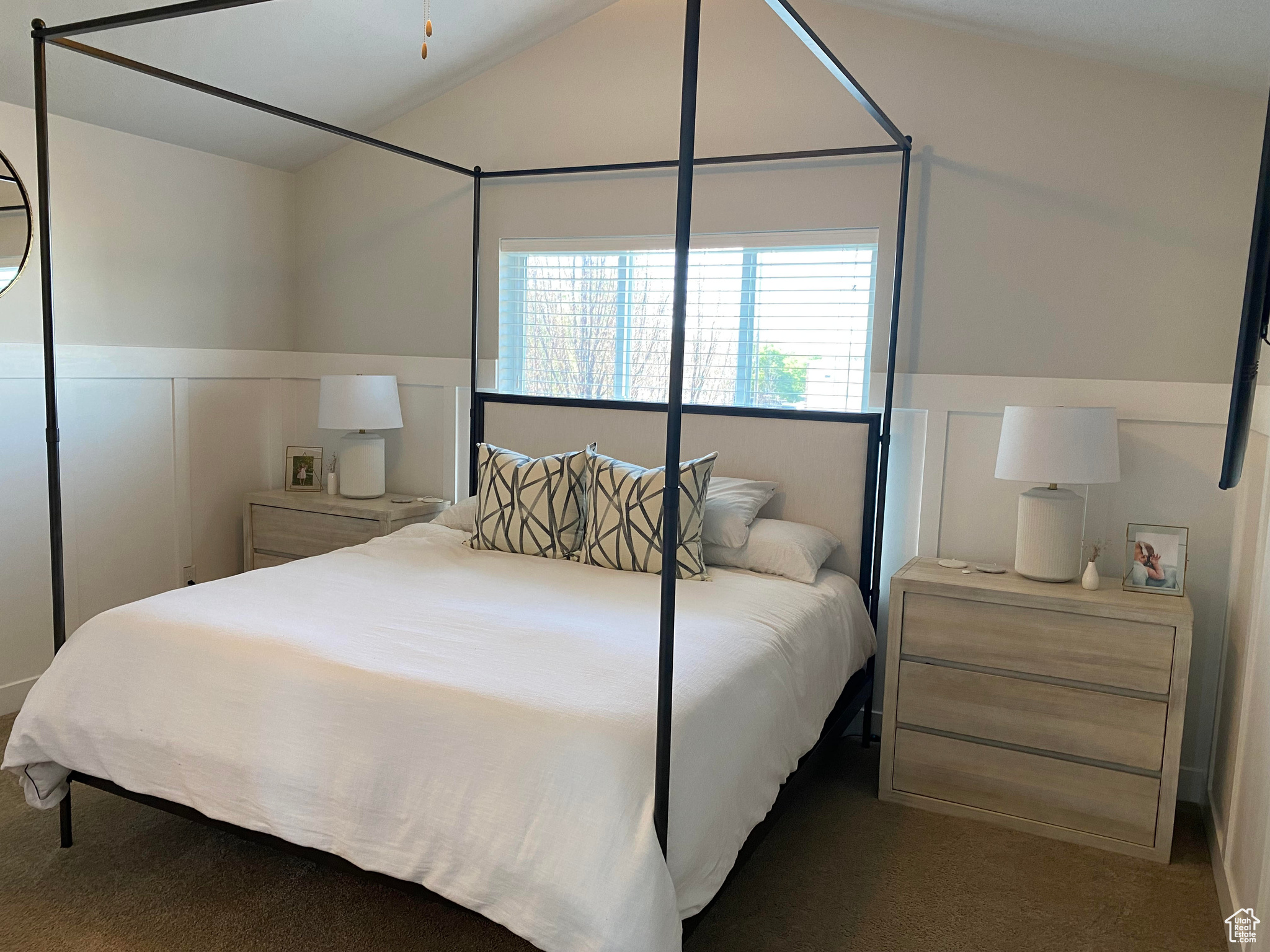 Carpeted bedroom with lofted ceiling