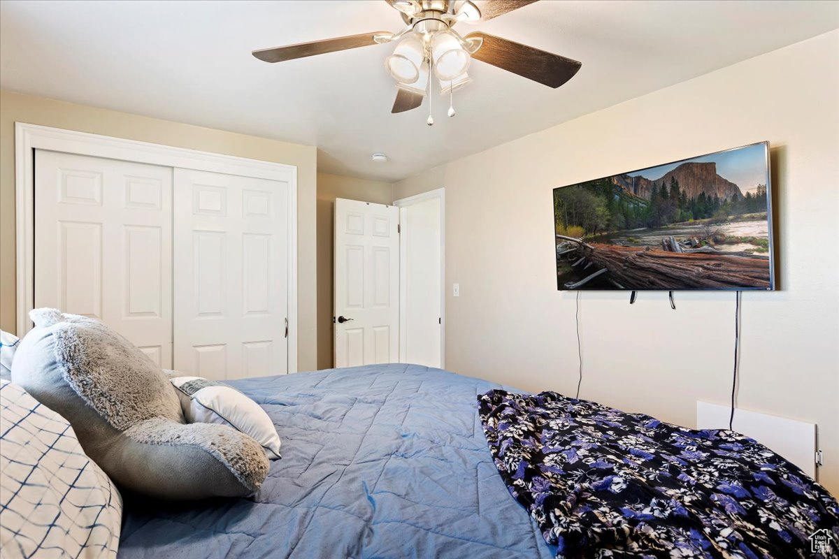 Bedroom with a closet and ceiling fan