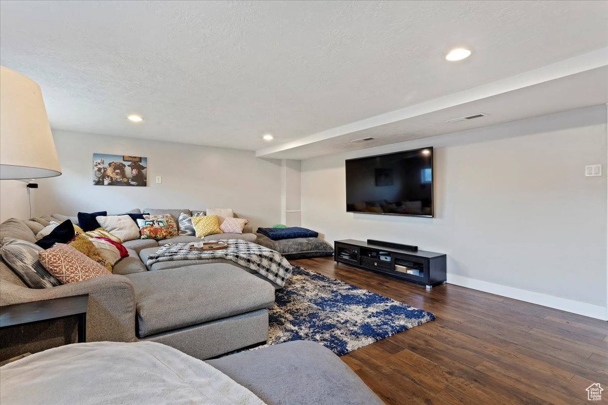 Living room featuring dark hardwood / wood-style flooring