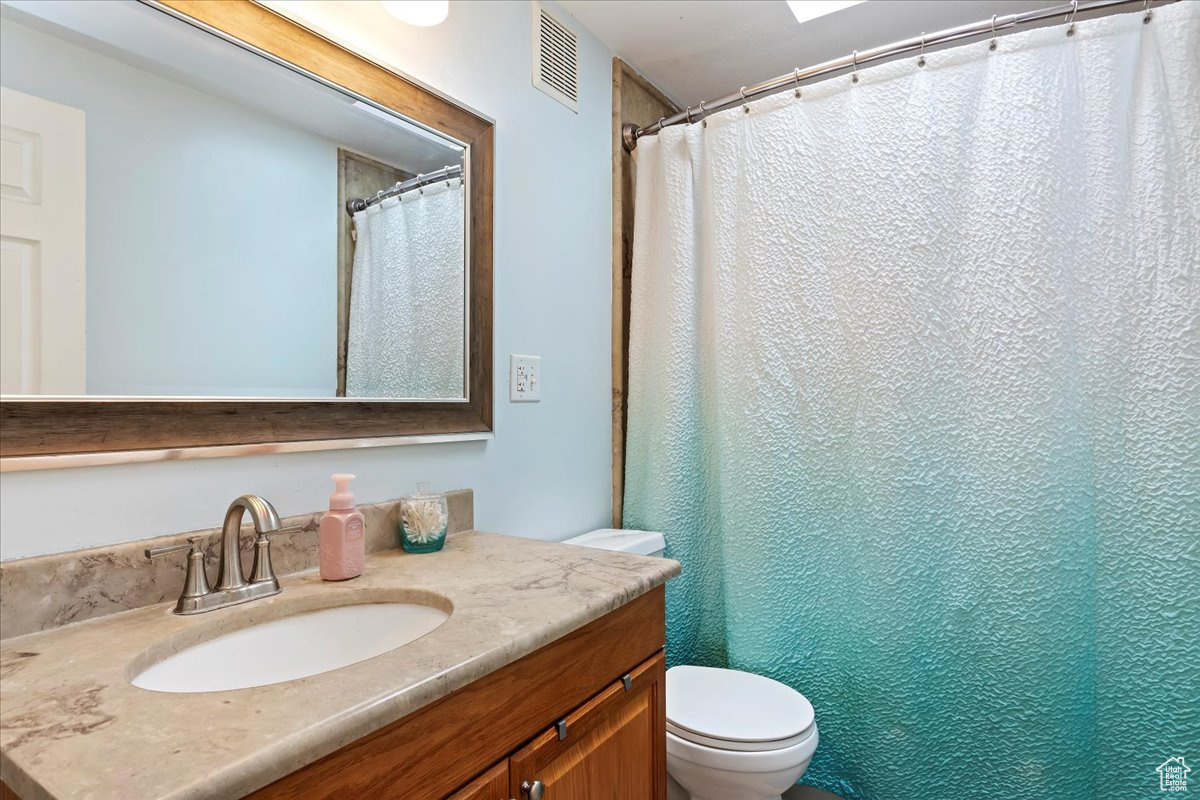 Bathroom featuring toilet and vanity