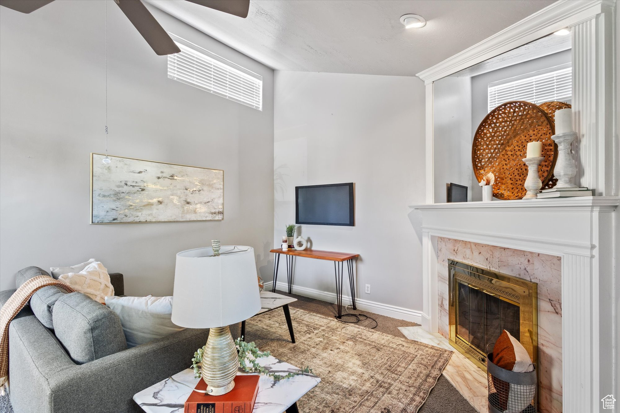 Living room with a custom marble fireplace and vaulted ceilings